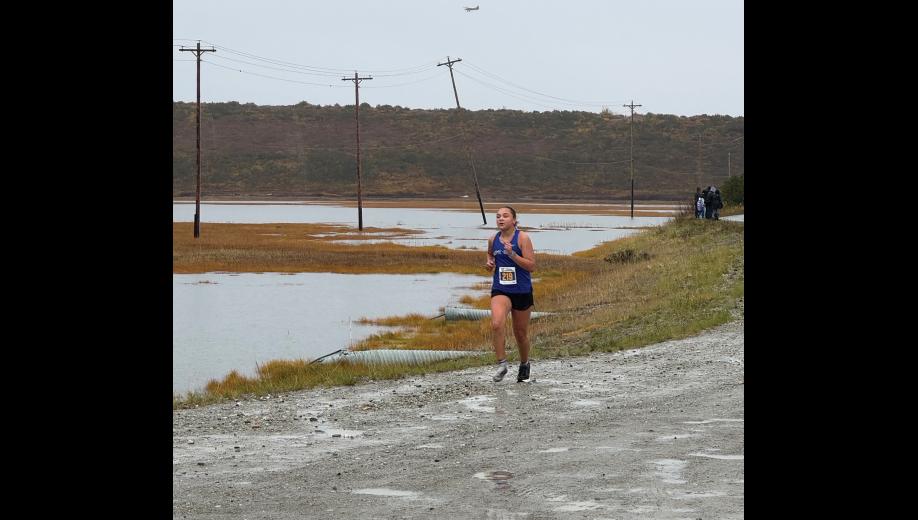 Lexi Blandford completed the Kotzebue XC Invitiational race with one shoe, after having lost the other one in a mud puddle. Photo by Chelsea Hubert