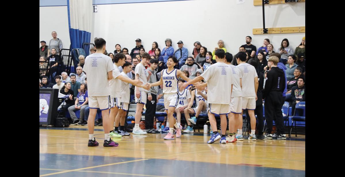 Photo by Anna Lionas Nanook Lane Scheurch high fives his teammates