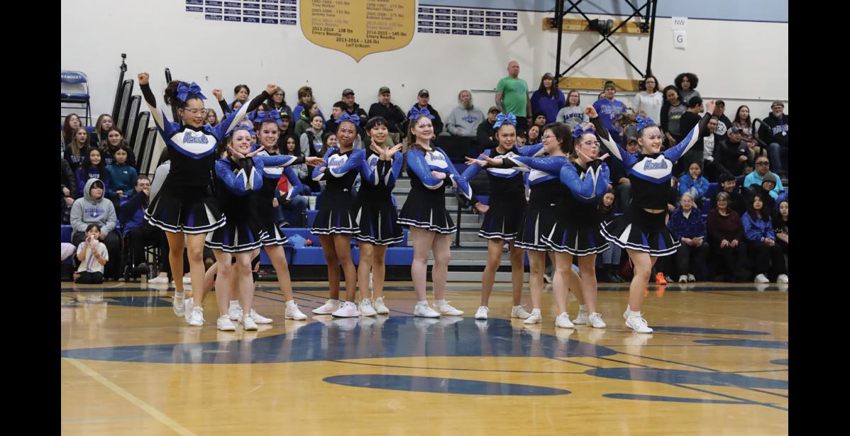 Photo by Anna Lionas Nome-Beltz cheer squad performs during halftime.
