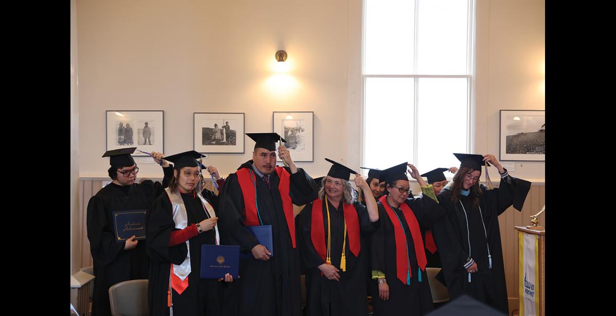 Photo by Anna Lionas RIGHT TO LEFT–Graduates make the symbolic move of their tassels from right to left, signifying completion of their degree. The commencement for the University of Alaska Northwest Campus took place at Old St. Joe’s on May 9.