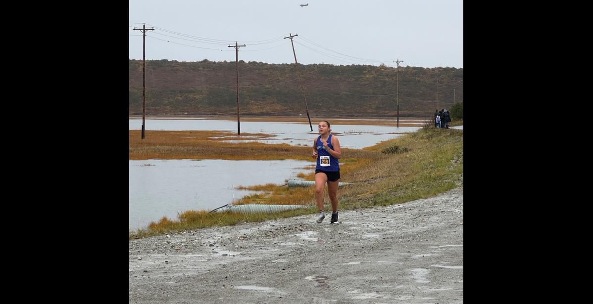Lexi Blandford completed the Kotzebue XC Invitiational race with one shoe, after having lost the other one in a mud puddle. Photo by Chelsea Hubert