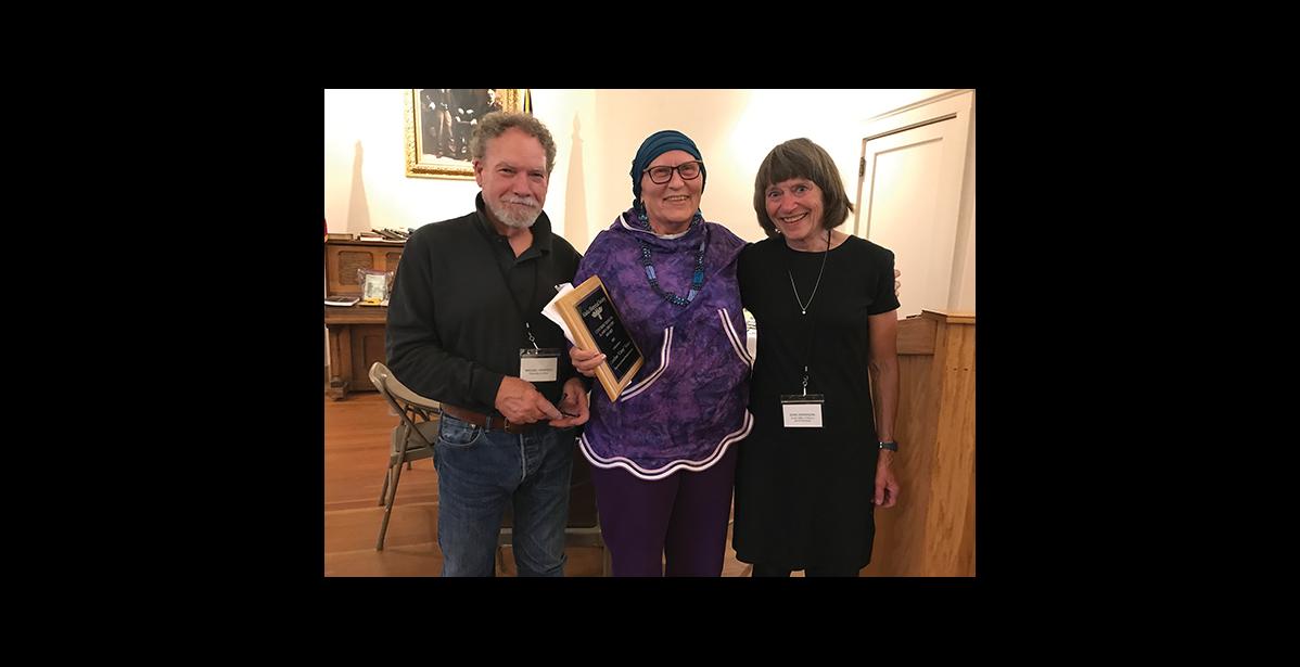 Photo by Amy Phillips-Chan AWARD— Local historian Cussy Kauer, center, was presented with the Contributions to Alaska History Award by Michael Hawfield, left, and Joan Antonson, right, Director of the Alaska Historical Society during the Awards Banquet after the joint Museums Alaska and Alaska Historical Society conference in Nome