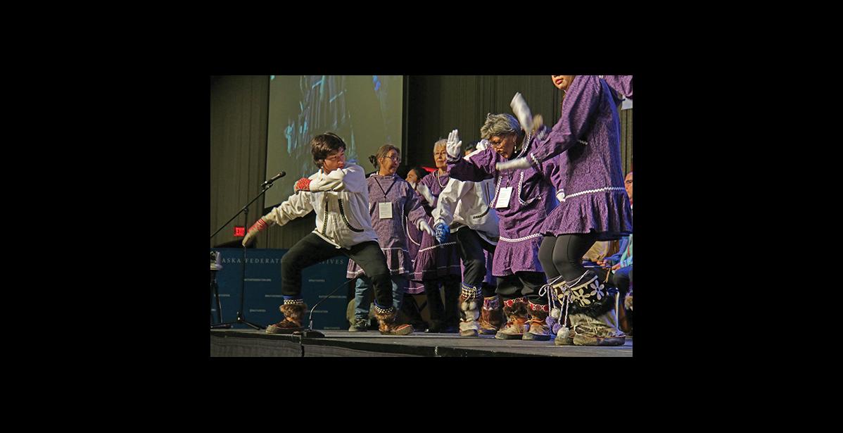 Photo by Julie St. Louis AFN QUYANA— Nome’s David Miller joined the Kingikmiut Dancers and Singers of Anchorage to entertain the crowd during last week’s Quyana dances at the Alaska Federation of Natives Convention in Anchorage.