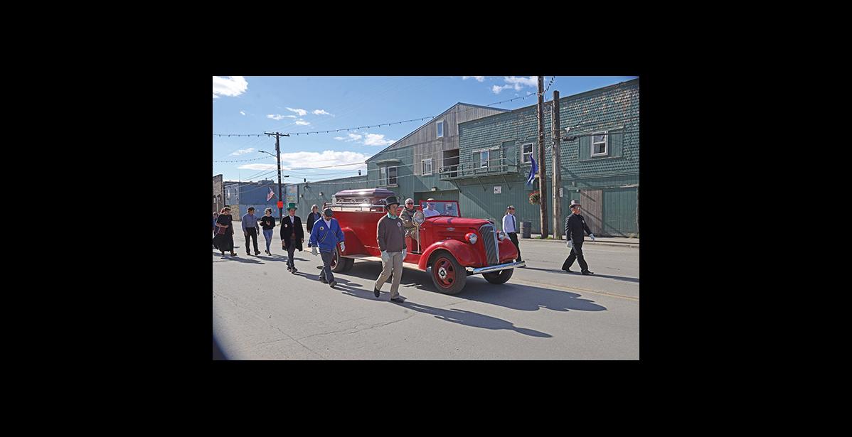 Photo by Lizzy Hahn HONORING RICHARD— Pall bearers Kenneth Hafner, Boogles Johnson, Andrew Hafner, Bob Hafner, Nicholas Klescewski and Jake Kenick walk beside Richard Beneville’s coffin during the memorial procession through Nome, on June 20.