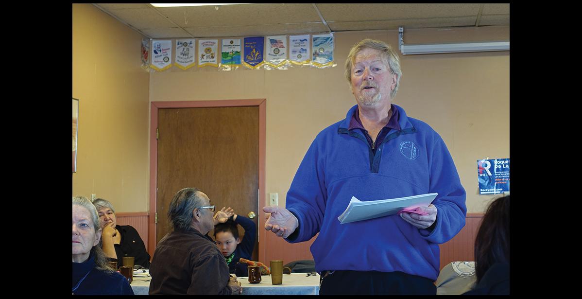Photo by Maisie Thomas DEMOCRATIC CAUCUS—Lew Tobin reads instructions at Nome's Democratic Caucus on Saturday.