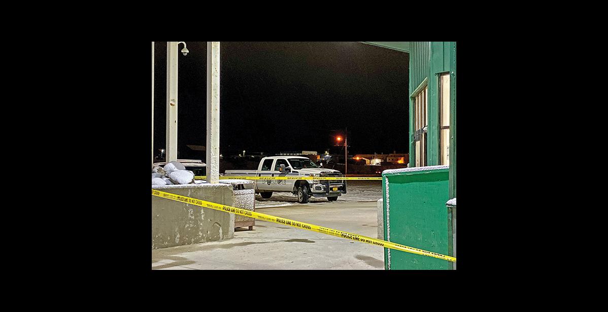 Photo by Sandra Medearis BREAK-IN—NPD officers secured a crime scene at the Alaska Commercial Store on Nome-Teller Highway following a robbery Oct. 19.