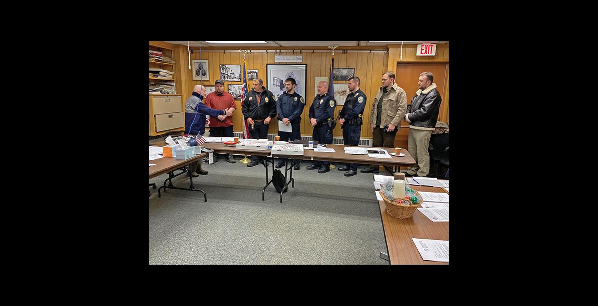 Photo by Sandra Medearis NOME’S LAW ENFORCEMENT SERVICE—Nome police officers turned out for a Nome Common Council meeting Dec. 9 where their newest member, Austin Martino took his oath of office. (l to r) Jonathan Jachim, from Fairbanks; Interim Chief Mike Heintzelman, Virginia; Austin Martino, New York; Sgt. Marc Morris, Georgia; Justin Stein, Idaho; Cordell Murray, Kentucky; Raymond Murray, Texas.