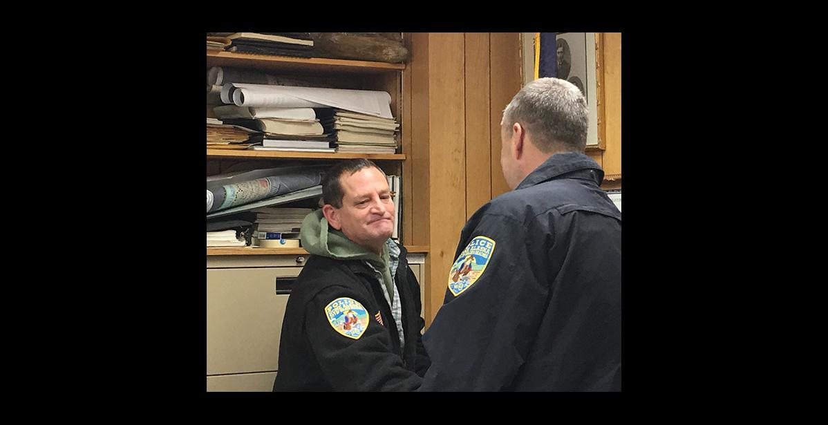 Photo by Sandra Medearis SWORN IN—Bob Pruckner receives congratulations from NPD Chief Bob Estes after taking oath of office as newly hired police officer.