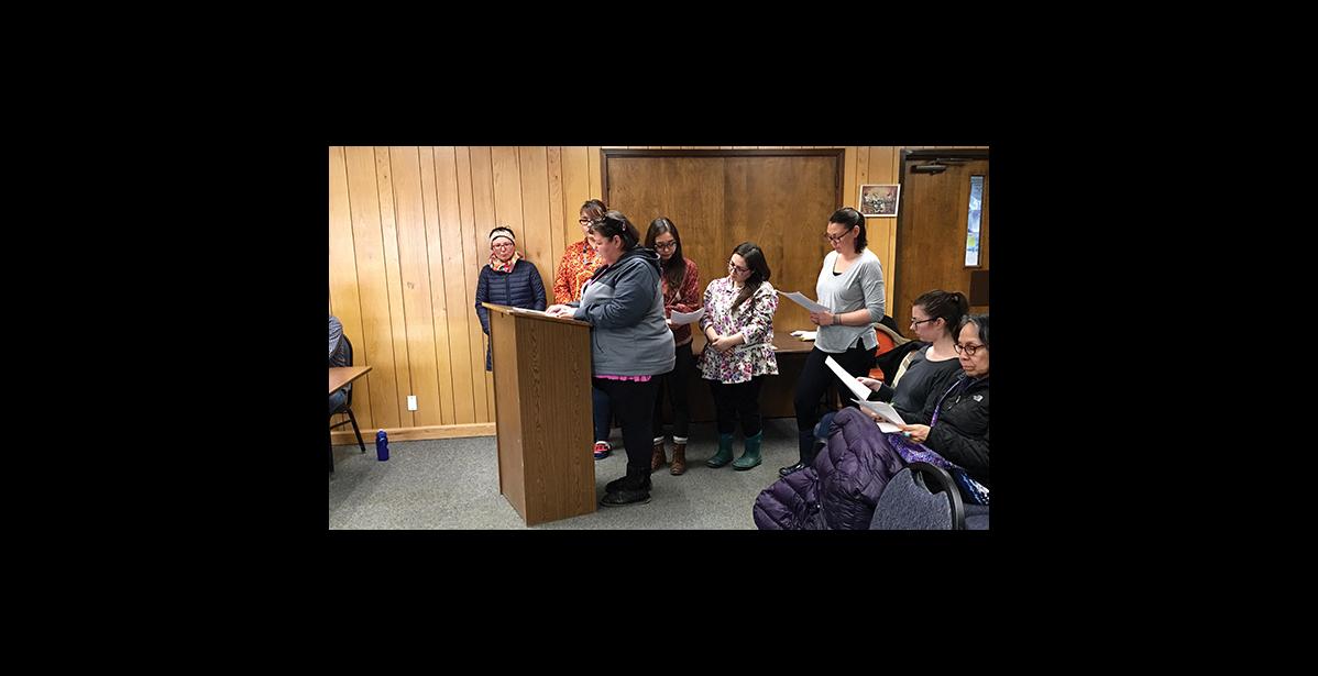 Photo by Sandra Medearis CONCERNED—Many women attended a work session with the City administration to declare a need to work with the City and other agencies to address crimes of sex assault and domestic violence in the Nome area. A group took the podium to take turns reading a proposed resolution: (left to right) Lisa Ellanna, Niviaaluk Brandt, LaVerne Ashenfelter (at podium), Tehya Tucker, Panganga Pungowiyi and Darlene Trigg.