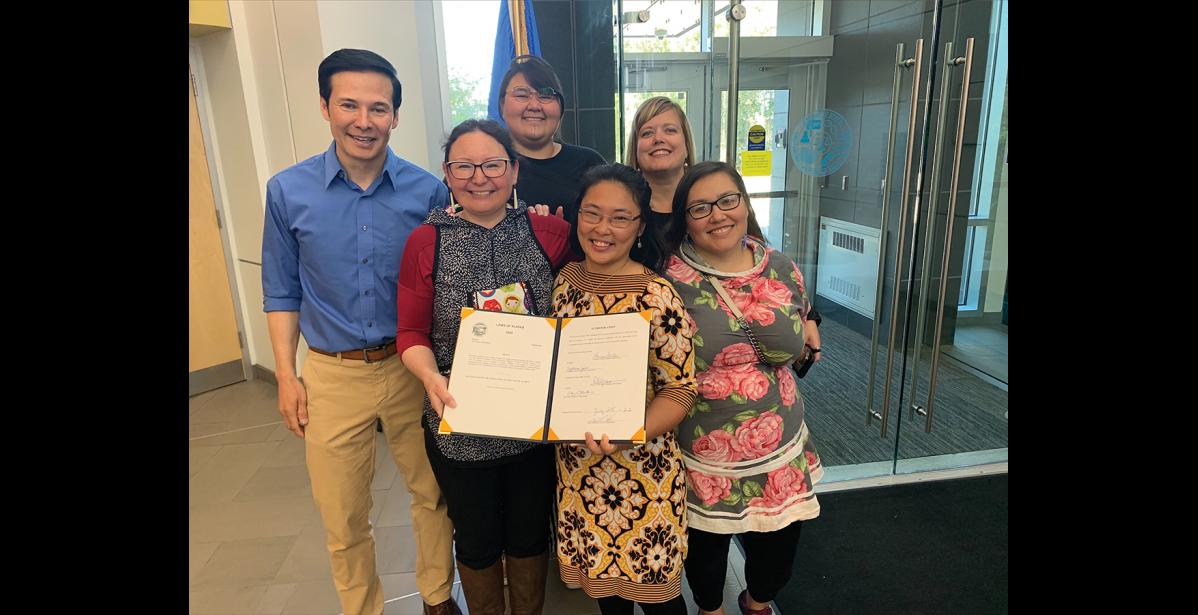 Photo courtesy Lisa Ellanna CONSENT BILL— Present at the ceremonial signing of HB 325 were (left to right) Rep. Neal Foster, Lisa Ellanna and her daugther Nivi Brandt of Nome, Juneau advocate Katie Botz, Rep. Geran Tarr and Panganga Pungowiyi.