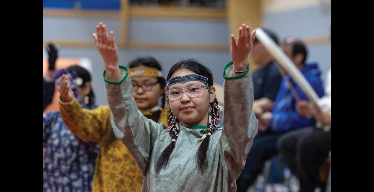 Photo by Ariana Crockett O’Harra QUGHSATKUT DANCERS— Grace Campbell performs with the Qughsatkut Dancers and the Nome St. Lawrence Island Dance Group during Katiluta at the Nome Rec Center on Friday, May 1.
