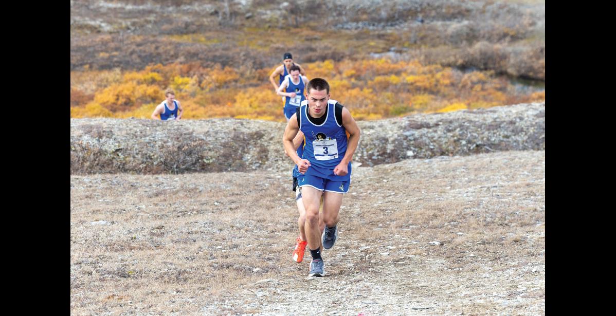 UP THE HILL – Jackson Iverson leads a pack of runners up towards Glacier Creek Road at the Big West Regional Meet at Nome-Beltz High School on Saturday, September 26. Photo by Ariana Crockett O'Harra