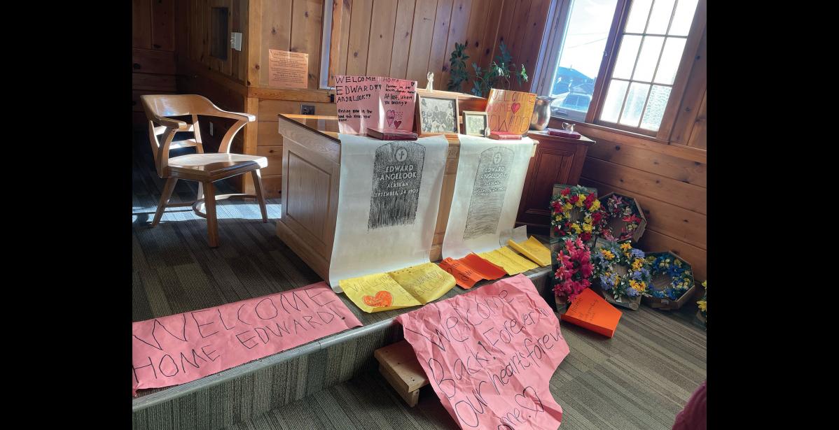 MEMORIAL – Signs displayed inside the church in Unalakleet where his memorial was held. Photo courtesy of Amber Cunningham.