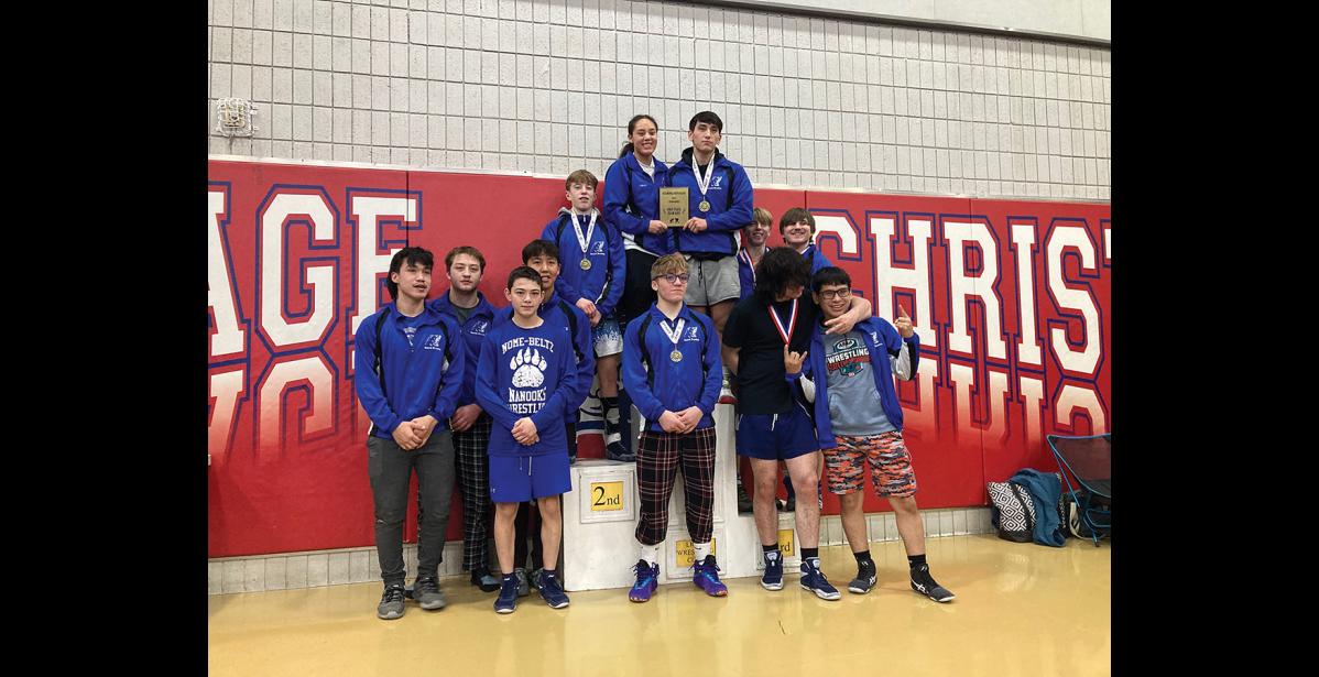 THE TEAM— Jaden Jorgenson, Tommy Cushman, Ben Milton, Wyatt Ahmasuk, Duke McGuffey, Kael Osborne, Andy Peterson. Standing on the platform from left to right are Young Erikson, Natallie Tobuk, Karlin Ahwinona-Smith, Son Erikson and Lucas Marvin.