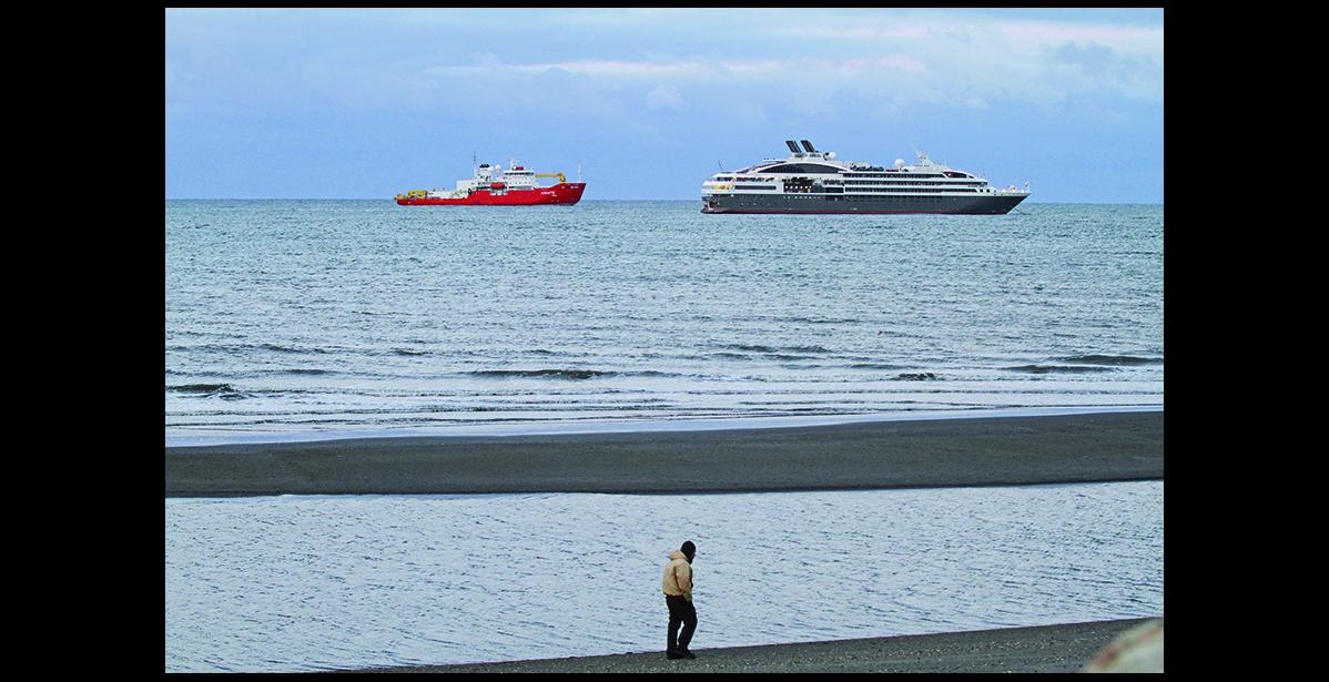 Nome Nugget file photo by Diana Haecker CRUISIN'— A cruise ship and a U.S. Coast Guard cutter anchor in Nome's roadstead in September 2015. A multi-agency drill is scheduled for this summer that simulates a major cruise ship disaster.