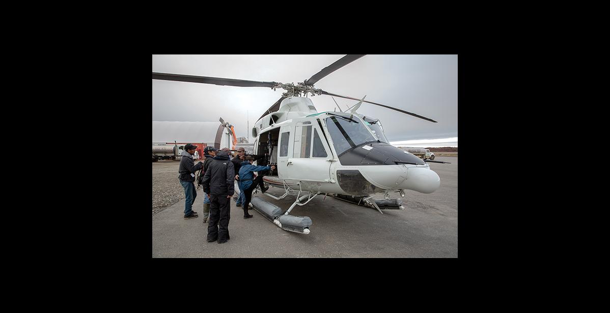 Photo by James Mason ALL ABOARD— Passengers for Diomede board the Pathfinder helicopter on Monday, Oct. 22 at the Nome Airport.