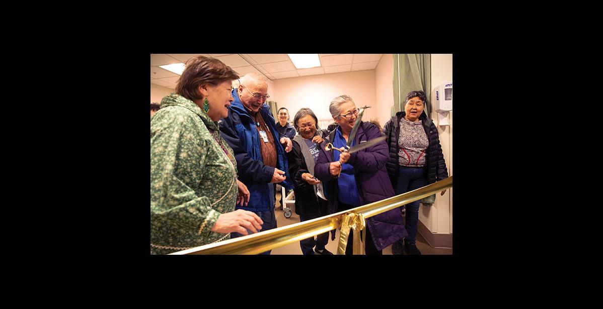 Photo by James Mason BIG SCISSORS – NSHC board member Alice Fitka wields the big scissors to cut the ceremonial ribbon at the dedication of the hospital’s new MRI machine. From left are Berda Willson, Native Village of Council; Alfred Sahlin of Nome Eskimo Community; Jean Ferris of Stebbins; Alice Fitka of St. Michael and Mathilda Hardy, Native Village of Shaktoolik.