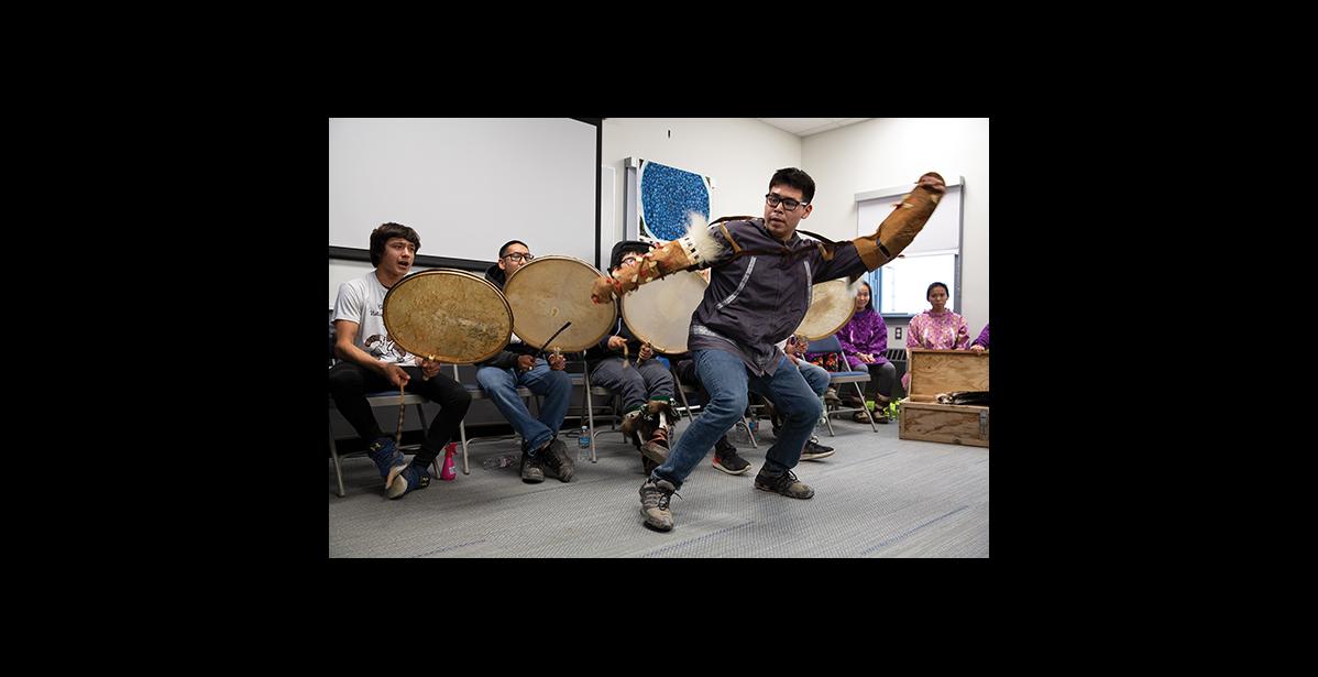 Photo by James Mason CELEBRATING—Eddie Kakaruk with the King Island drummers and dancers helped celebrate the commemoration of new UAF Northwest Campus buildings.
