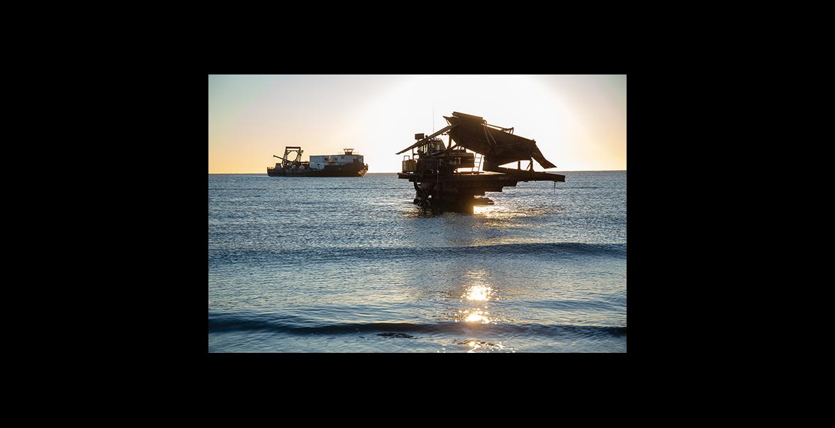 Photo by James Mason HAULING OUT— The Tagiuk Provider is at anchor and the crawler is making its way out to attach a tow line.