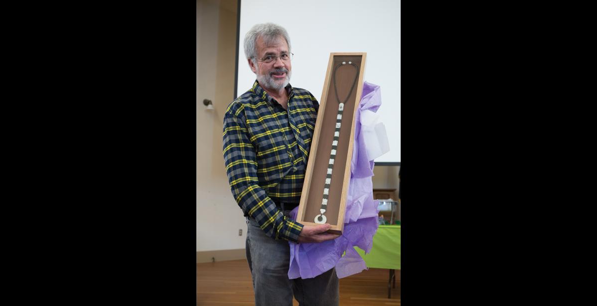 Photo by James Mason CELEBRATED— Dr. Head received a beautiful stethoscope created by Nome artist Joe Kunnuk during an appreciation event at Old St. Joe’s on Saturday, April 7.