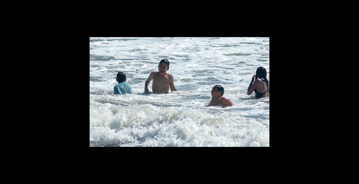 Photo by James Mason STAY COOL – Youngsters beat the heat during the peak of the heat wave by getting into the Bering Sea
