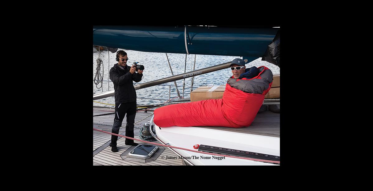 Photo by James Mason VIDEO TIME – With two film crews aboard the Pangaea there’s always a camera around. Mike Horn tries out the Norwegian cold weather sleeping bag which just arrived