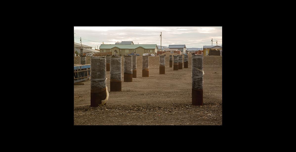 Photo by James Mason PILINGS – Pilings for the foundation of the Liitfik Wellness Center await construction in Nome.