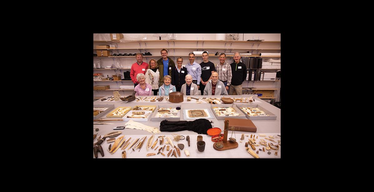 Photo by James Mason DONATION TO THE MUSEUM— Descendants of Tom and Ellen Lopp donated a trove of artifacts that were collected by the Lopps while in Wales around the turn of the 19th century. They posed before much of the collection for a group photo Saturday at the Carrie M. McLain Memorial Museum.