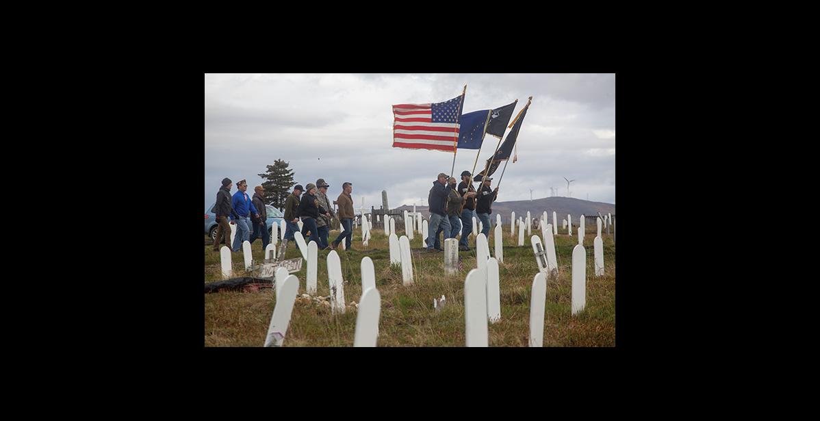Photo by James Mason MEMORIAL DAY 2020 – Flag bearers and veterans make their way to the site of the Memorial Day service in Nome’s cemetery Monday.