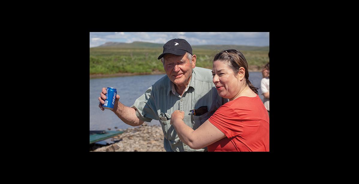 Photo by James Mason NOME CITIZEN OF THE YEAR— Louie Green Sr., pictured here with his daughter at the Midnight Sun Nome River Raft Race in June, was awarded the Nome Citizen of the Year award from the Rotary Club.