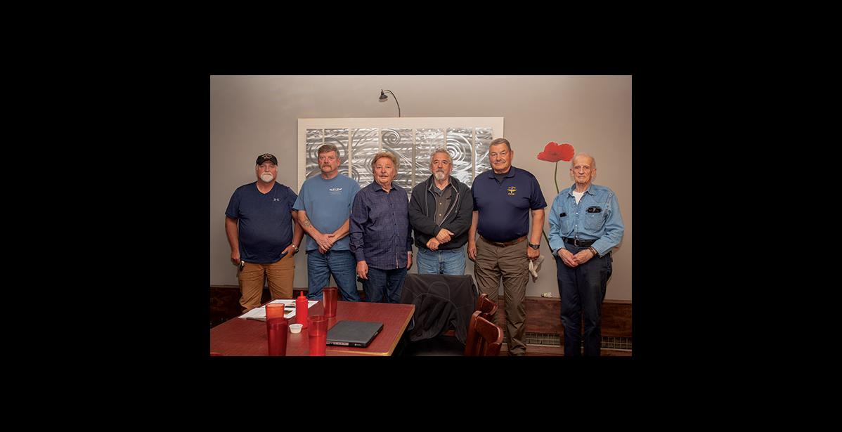 Photo by James Mason THE RESCUE— Survivors and rescuers of the dramatic air-sea rescue 25 years ago met for dinner Saturday evening in Nome. From left are rescuers Kevin Ahl, Randy Oles, survivor Dave Anderson and rescuers Terry Day, Eric Penttila and Vic Olson.