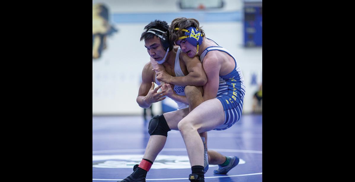 Photo by James Mason OUTSTANDING WRESTLER—Elden Cross wrestles his Kotzebue opponent in the 145-lbs championship match Saturday, which he won, during the Regional Wrestling Tournament, held in Nome last weekend. Cross was named Outstanding Wrestler.