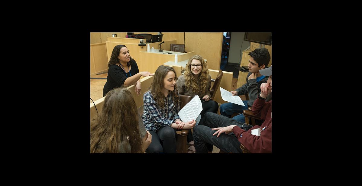 Photo by James Mason YOUTH COURT— Nome Youth Court director Pamela Smith explains to student volunteers how they will learn mediation in this exercise at the Nome Trial Court. From left clockwise are Ava Earthman, Katie Kelso, Maya Coler, Scott Santella of Anchorage’s West High, and Marek Grieme of Kenai. The United Youth Courts of Alaska held their annual meeting in Nome last week.