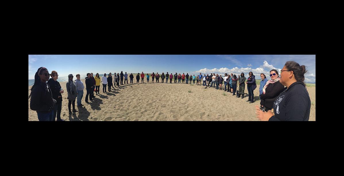 Photo by EJ David THE CIRCLE –Truth, Racial Healing and Transformation leaders form a circle in Solomon during their visit Wednesday.
