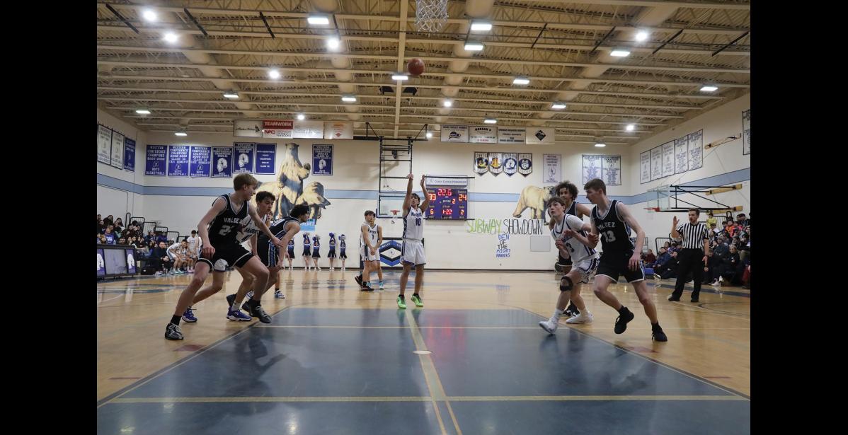 Photo by Anna Lionas Jon Smith of Nome takes a shot as the Buccaneers and Nanooks prepare to grab the rebound.