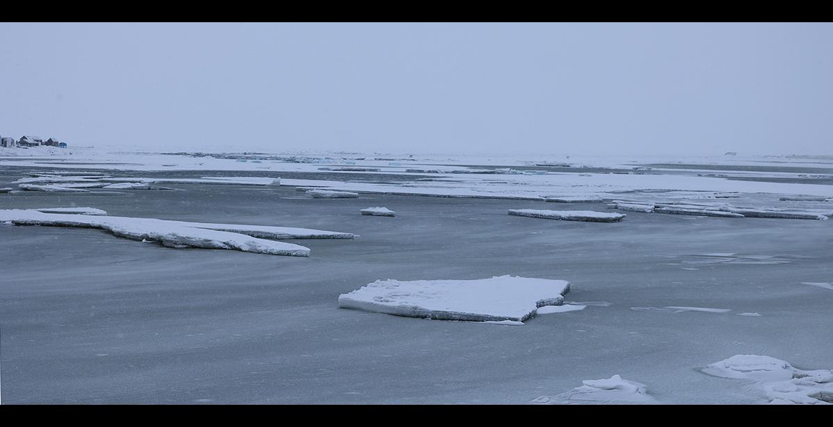 Photo by Diana Haecker OPEN WATER— The storms broke up ice and left the mouth of the Nome River with ice floes bobbing in open water.