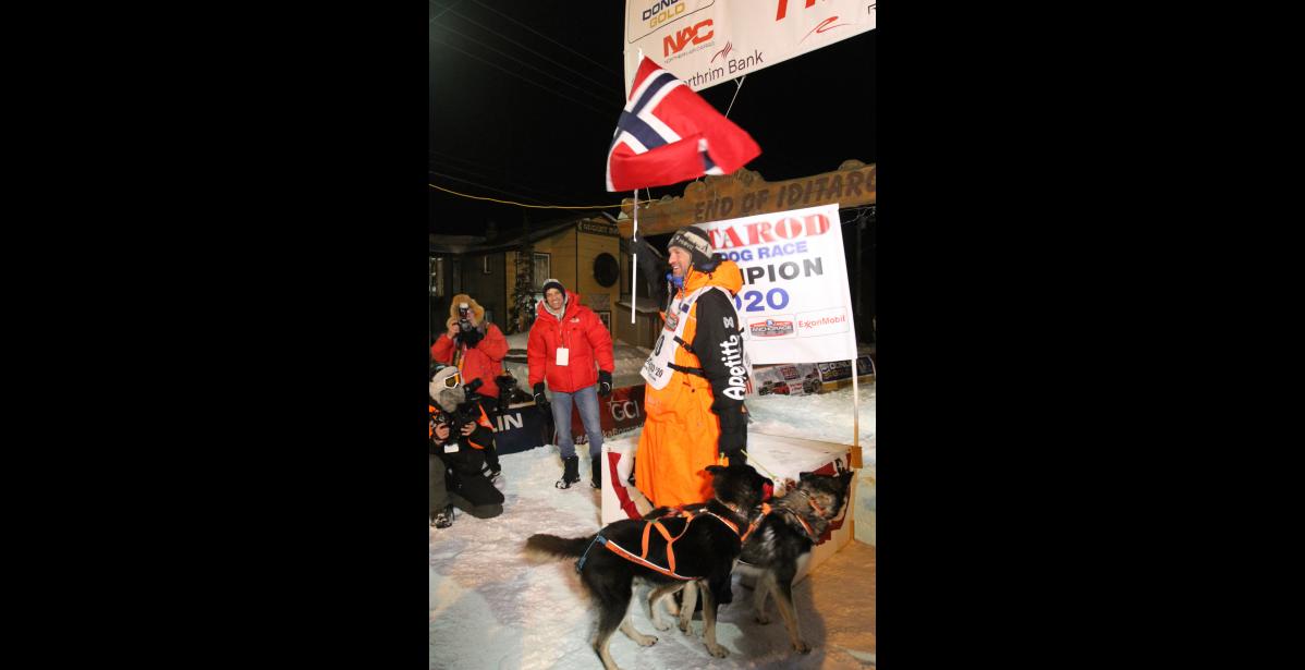 Photo by Diana Haecker Thomas Waerner waving the Norwegian flag at the finish line.
