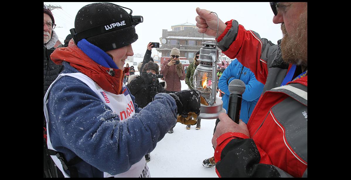 Photo by Diana Haecker IDITAROD 2020 RED LANTERN— Kaci Murringer was the last musher of this year’s Iditarod to arrive under the burled arch on Sunday, March 22, after 13 days, 22 hours and 29 minutes on the trail.