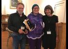 Photo by Amy Phillips-Chan AWARD— Local historian Cussy Kauer, center, was presented with the Contributions to Alaska History Award by Michael Hawfield, left, and Joan Antonson, right, Director of the Alaska Historical Society during the Awards Banquet after the joint Museums Alaska and Alaska Historical Society conference in Nome