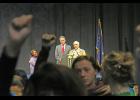 Photo by Julie St. Louis AFN Co-chairman Will Mayo interrupts Gov. Dunleavy’s speech to admonish protestors for showing disrespect to an invited speaker with their standing, fists raising, chanting and drumming.