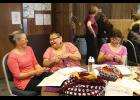 Photo by Lizzy Hahn MK Romberg, Caroline Muktoyuk-Brown and Loretta Bullard share a laugh at the crocheting table at the Fiber Fest.
