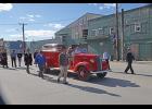 Photo by Lizzy Hahn HONORING RICHARD— Pall bearers Kenneth Hafner, Boogles Johnson, Andrew Hafner, Bob Hafner, Nicholas Klescewski and Jake Kenick walk beside Richard Beneville’s coffin during the memorial procession through Nome, on June 20.