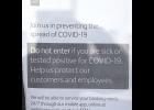 Photo by Nils Hahn SIGNS OF THE TIME— Businesses post signs at their doors warning people to stay out if they are sick