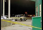 Photo by Sandra Medearis BREAK-IN—NPD officers secured a crime scene at the Alaska Commercial Store on Nome-Teller Highway following a robbery Oct. 19.