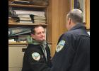 Photo by Sandra Medearis SWORN IN—Bob Pruckner receives congratulations from NPD Chief Bob Estes after taking oath of office as newly hired police officer.