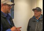 Photo by Sandra Medearis Howard Farley Sr. talks Pacific cod appearing in his crab pots in increasing numbers with research scientist Lyle Britt at an Aug. 2 Strait Science session. Farley has decades of experience in several Bering Sea fisheries. His son Harvey has been crabbing since 2001. The family business keeps records scientists find valuable.
