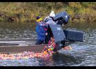 DUMPIN’ DUCKS (top) – Nicole Santonastaso, Sydney Boersma and Veronica Alviso dump rubber ducks into the Snake River for the Rotary Club of Nome’s Duck Race on Monday, September 7. Photo by Ariana Crockett O'Harra