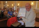 Photo by Diana Haecker HONORING RICHARD BENEVILLE— Beneville was gifted with a citation from the Alaska State Legislature honoring his many contributions to Nome and the state, during the Richard Beneville Day celebration on June 22, at Old St. Joe’s.