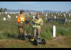 Photo by James Mason EARCHING FOR UNMARKED GRAVES— Logic Geophysics used ground penetrating radar to search for unmarked graves. Dr. Esther Babcock, left, analyzes the data. Caleb Babcock supplies the muscle.