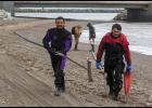 Photo by James Mason SEARCHING FOR FLORENCE – SAR divers Tom and Joe Akeya of Savoonga walk up the beach after a day of diving off the causeway seawall at Nome’s West Beach. They assisted the search for Florence Okpealuk, who has last been seen on August 30 at West Beach